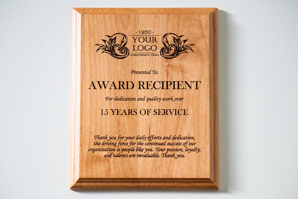 Laser-engraved wooden trophy with polished base and premium award design suitable for corporate and sports recognition.