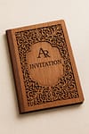 Elegant laser-cut wooden invitation cover with engraved design, perfect for weddings and luxury events.